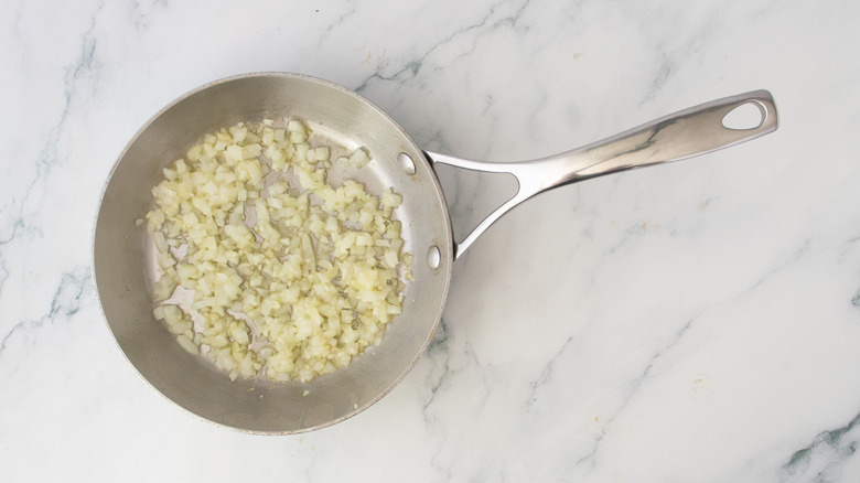 Sauteed garlic and onion in pan
