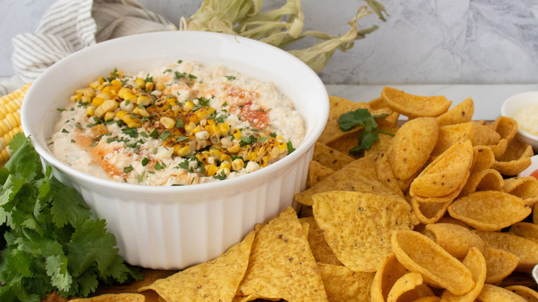 Bang bang corn dip served with tortilla chips and Fritos