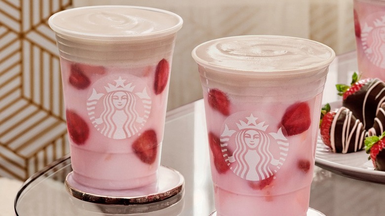 Two Starbucks Pink Drinks on table