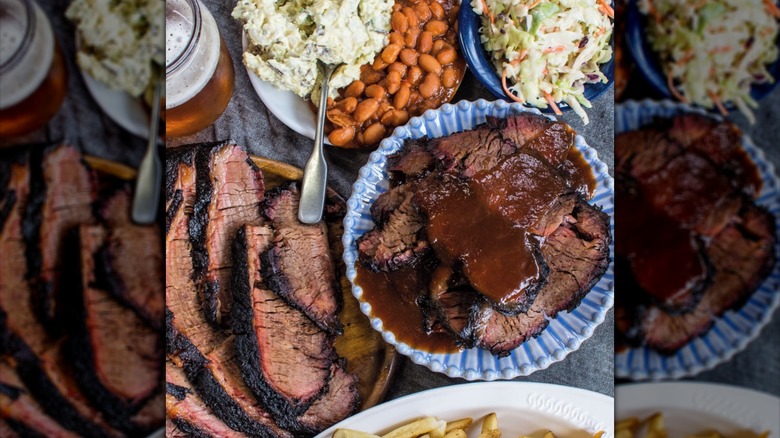 Plates of barbecue brisket, coleslaw, beans, potatoes, and fries