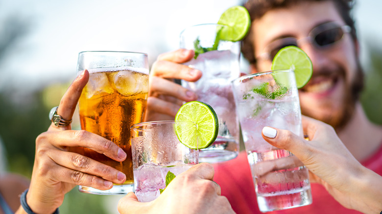 People toasting drinks