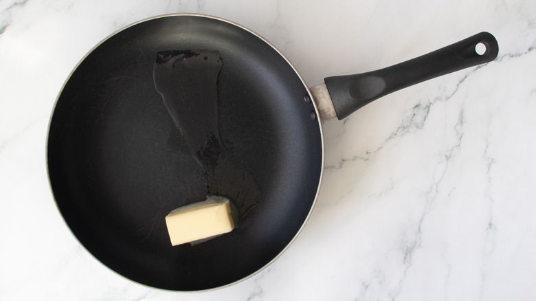 butter in a black frying pan