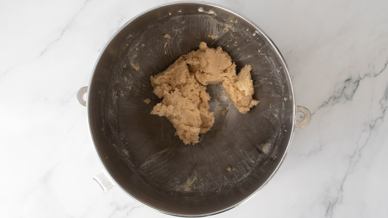 beige-colored butter and sugar mixture in a metal bowl