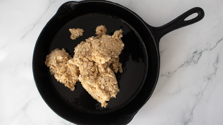 cookie dough in a black frying pan