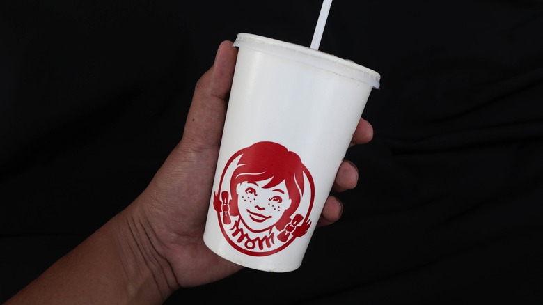 hand holding Wendy's cup
