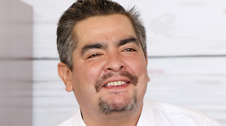 Aarón Sánchez smiling in head shot