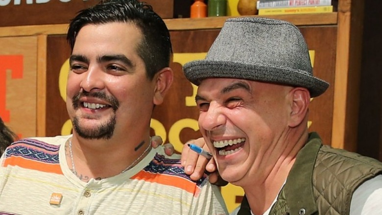 Aaron Sanchez and Michael Symon at book signing