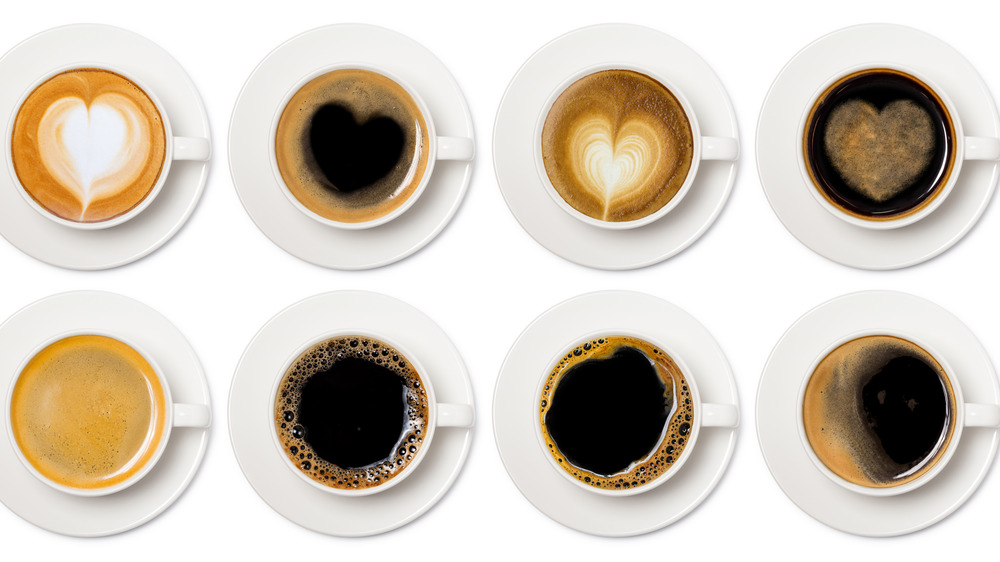 various kinds of coffee drinks in white cups