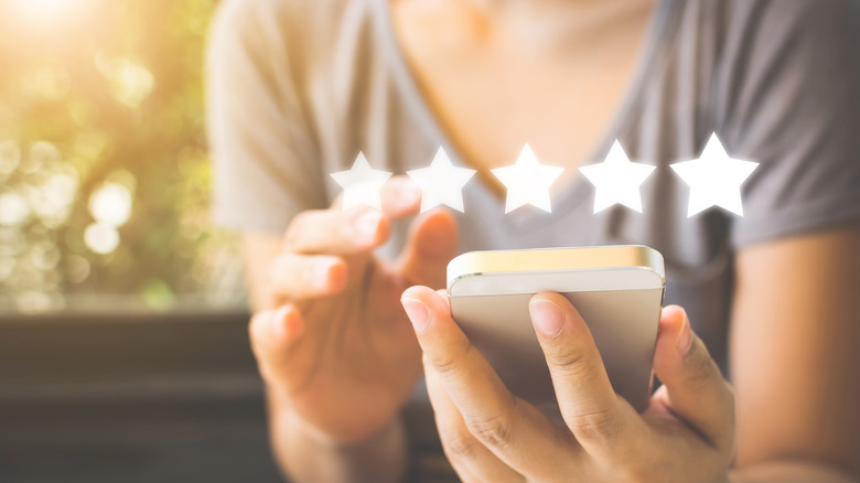 Phone user with rating stars