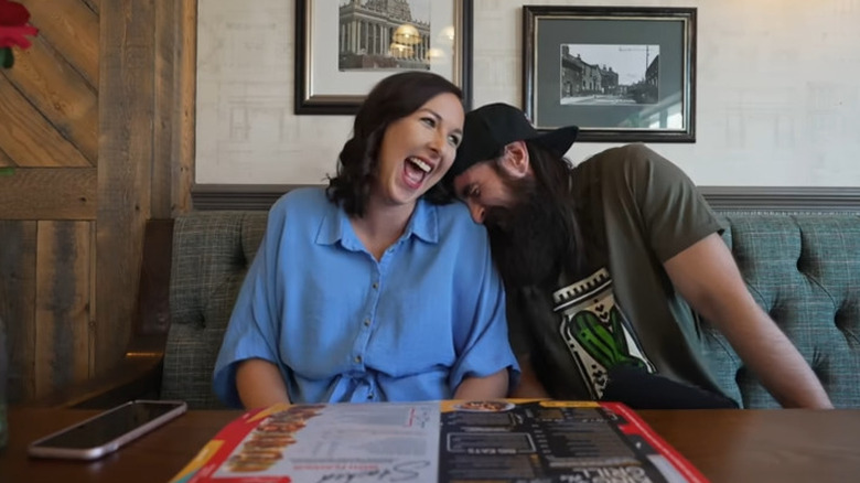 Adam Moran laughing with sister