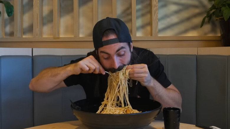 Moran eating spicy noodles