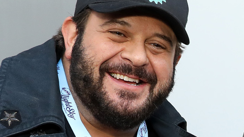 Adam Richman wearing cap