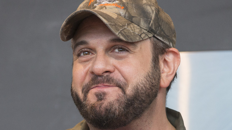 Adam Richman in camouflage baseball cap