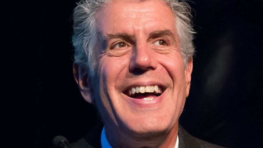 Anthony Bourdain smiling on stage