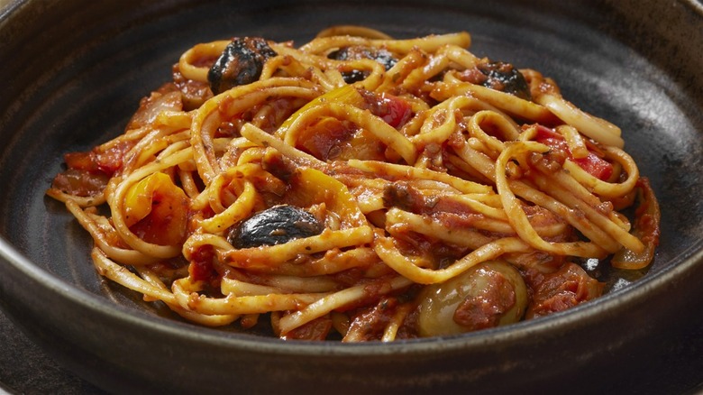 spaghetti bowl close-up with olives