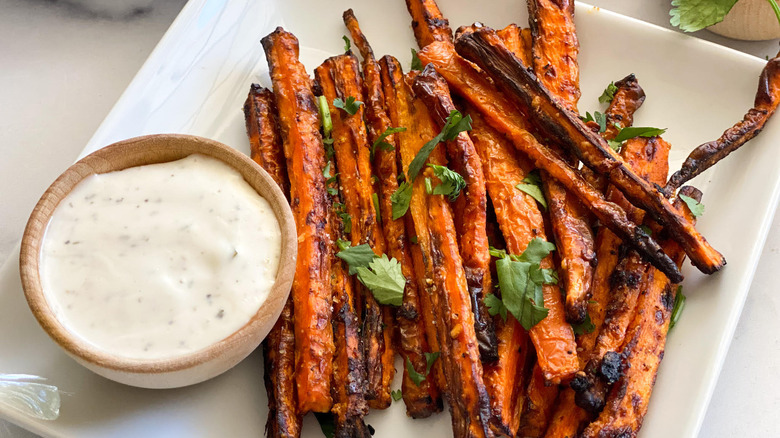 Air Fryer Carrot Fries Recipe on a plate with dip and cilantro