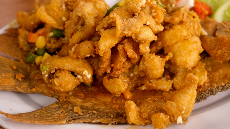 A pile of fried fish pieces on a plate