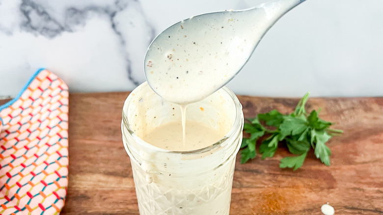 alabama white sauce in jar and spoon