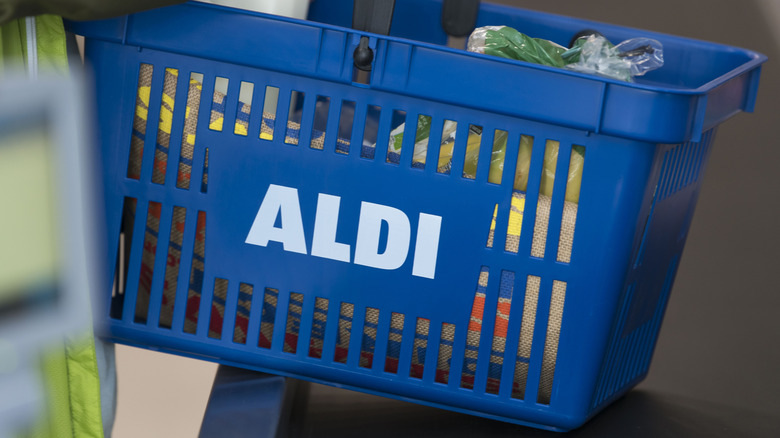 Blue Aldi shopping basket near register