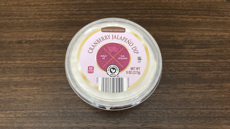 A photo of Aldi's limited-edition cranberry jalapeño dip from above, sitting on a wooden table.