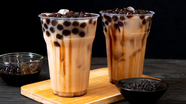 Brown sugar boba teas on a wooden board