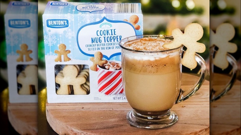 A peppermint mocha with a cookie mug topper from Aldi on the rim.