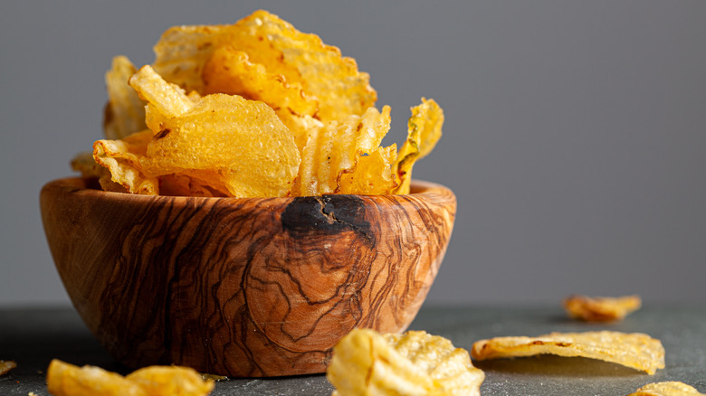 wooden bowl of kettle cooked potato chips