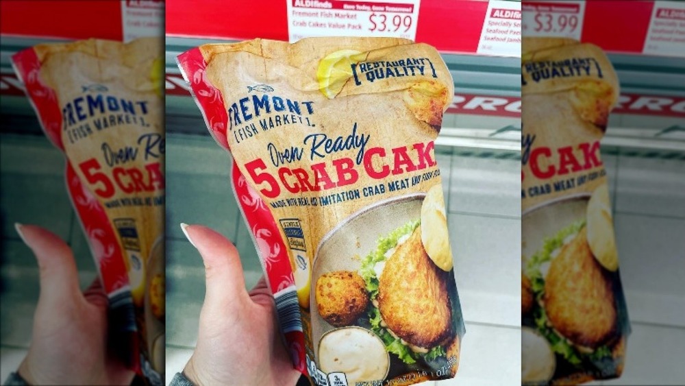 Hand holding new Aldi crab cakes