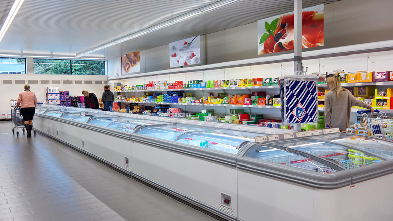 Aldi freezer section with shopping customers