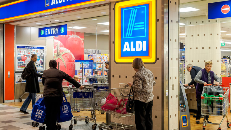 shoppers with carts at Aldi