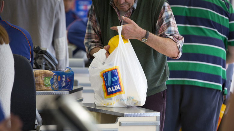 Customer using Aldi bag