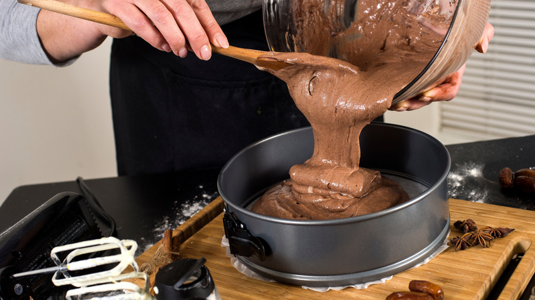 pouring batter into cake pan