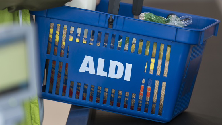 Aldi shopper with basket full of groceries
