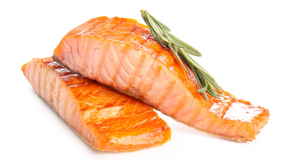 Cooked salmon fillet on white background