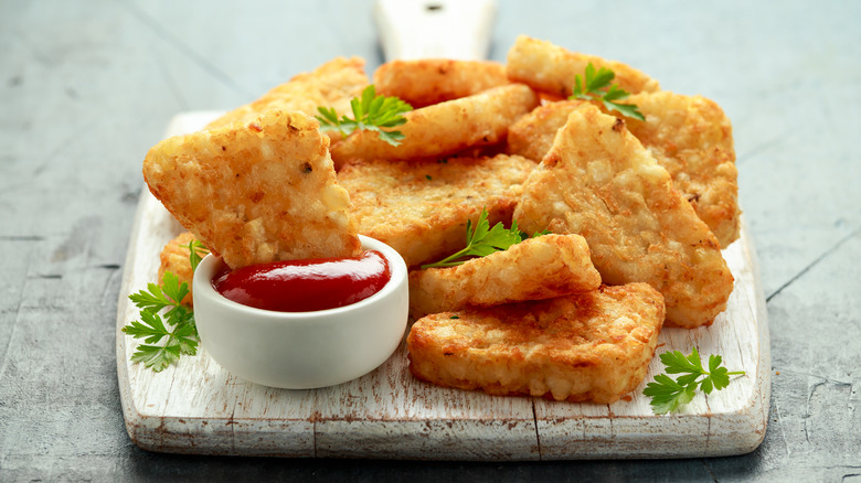 Hash browns on wood board