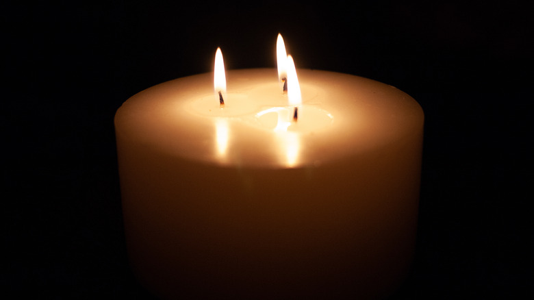 Candle on a black background