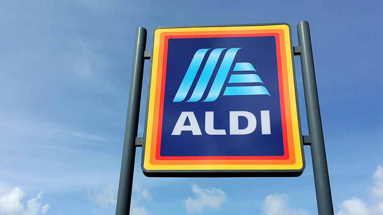 Aldi storefront sign on blue sky background