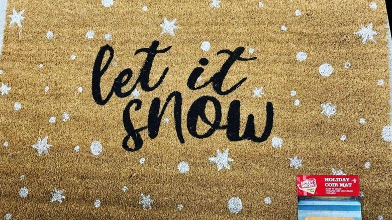 Aldi mat with black text saying Let It Snow