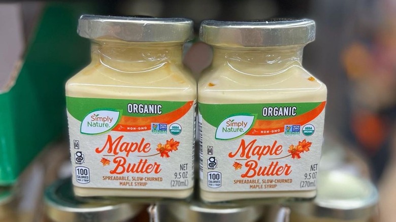 Clear containers of Aldi maple butter