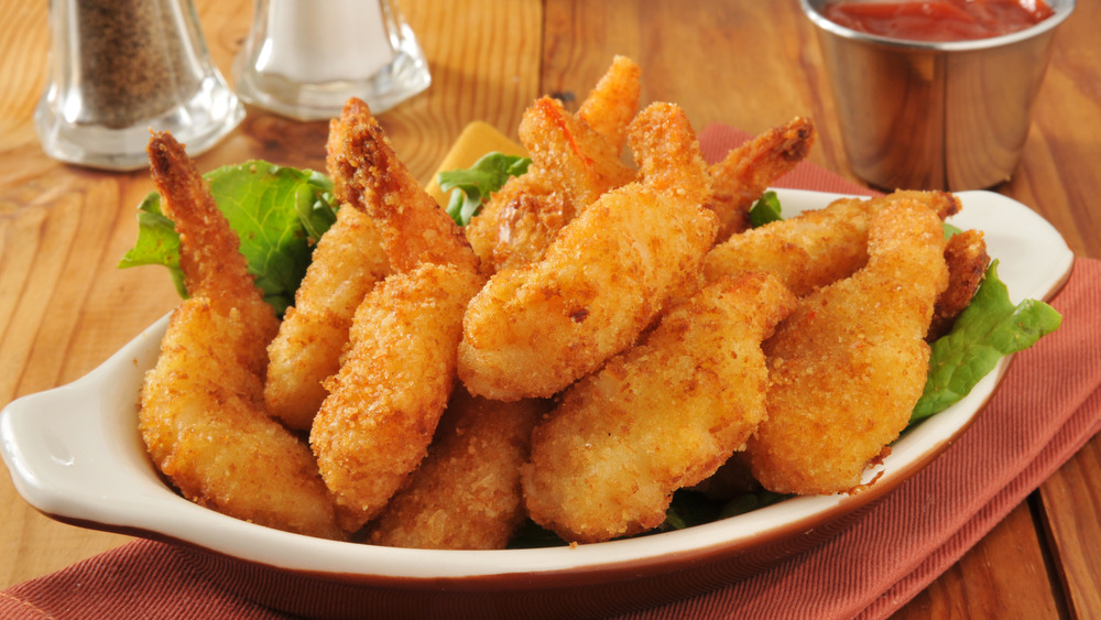 White plate of butterflied shrimp