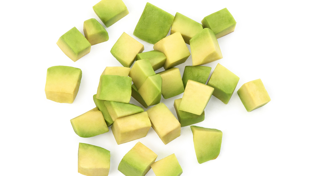 Diced avocado on white background