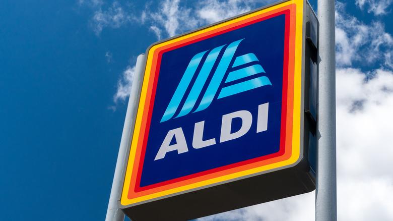 Aldi sign against blue-sky background