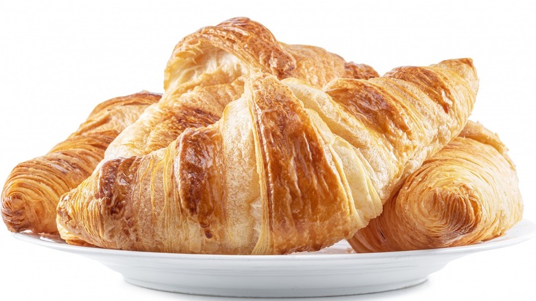 3 croissants on a white plate