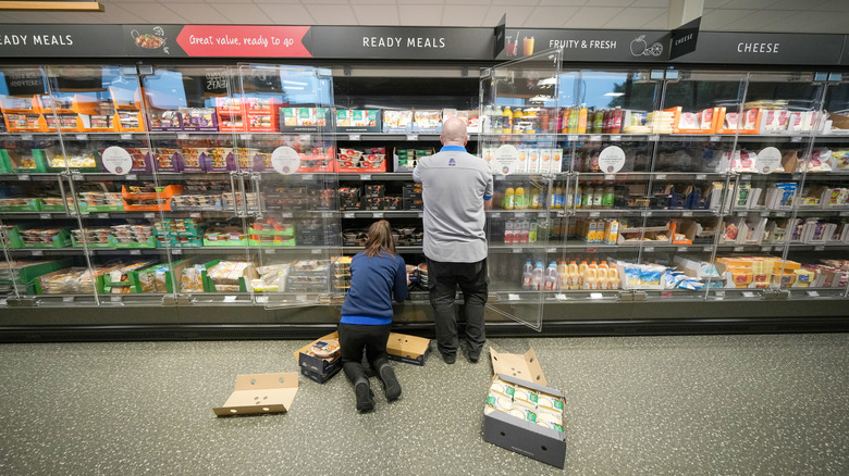Aldi workers stocking new items
