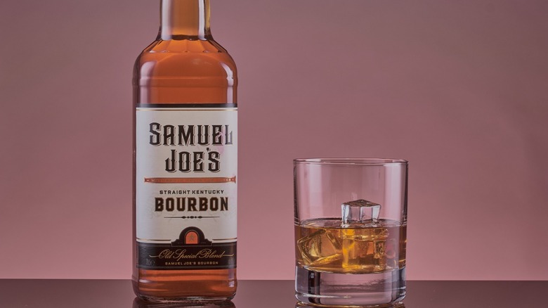 Bottle of Samuel Joe's Straight Kentucky Bourbon next to rocks glass.