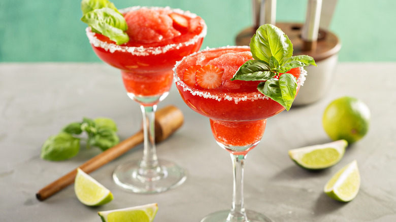 Two frozen strawberry margaritas