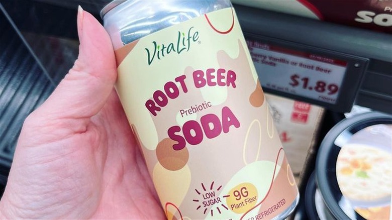 hand holding prebiotic root beer