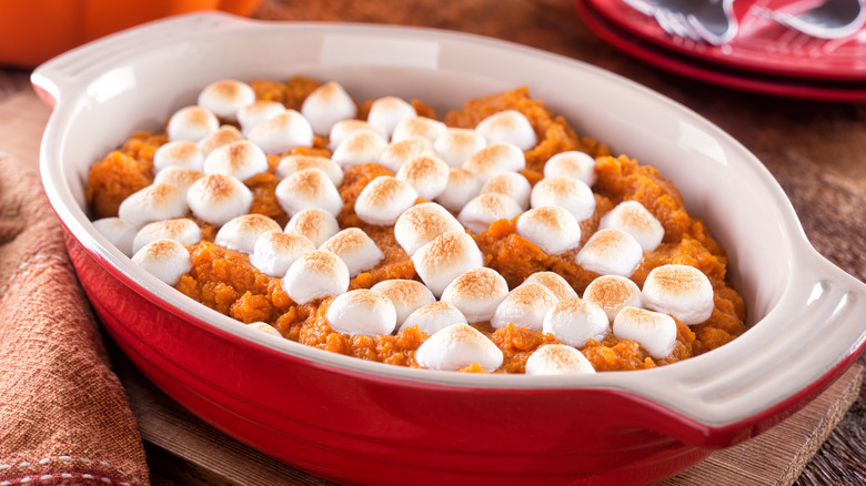 pot of sweet potato casserole and marshmallows