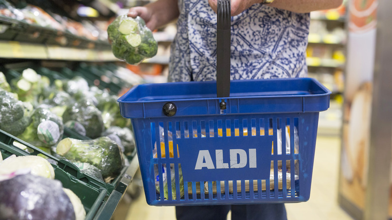 Man holding basket in Aldi