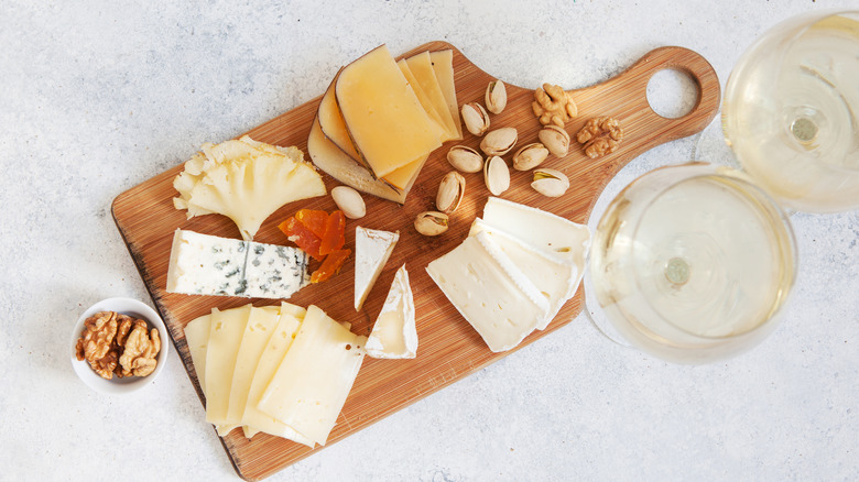 cheeseboard with nuts and wine